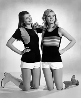 This pretty pair of team-mates are about to score in their black football vests This pretty pair of team-mates are about to score in their black football vests