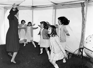 Prime Minister Margaret Thatcher seen here leading a group of children in a session of Prime Minister Margaret Thatcher seen here leading a group of children in a session of