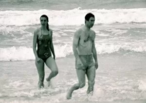 Images Dated 11th March 1979: Prince Charles in Australia with unidentified woman. Walking out of the ocean
