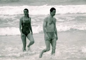 Prince Charles in Australia with unidentified woman. Walking out of the ocean Prince Charles in Australia with unidentified woman. Walking out of the ocean