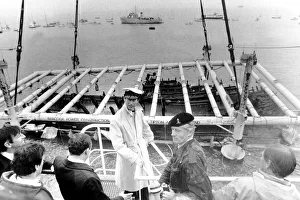 Prince Charles seen on the crane Tug Mor with the War Ship of Henry VIII as she breaks Prince Charles seen on the crane Tug Mor with the War Ship of Henry VIII as she breaks