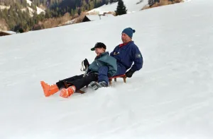 Prince Charles on a sledge with Prince Harry while on holiday in Klosters, Switzerland Prince Charles on a sledge with Prince Harry while on holiday in Klosters, Switzerland