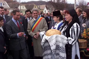 Prince Charles tastes bread and salt prepared by local women wearing traditional costume Prince Charles tastes bread and salt prepared by local women wearing traditional costume