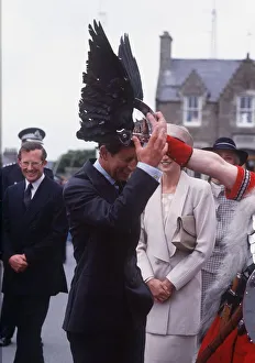 Prince Charles tries on a viking helmet watched by Princess Diana Prince Charles tries on a viking helmet watched by Princess Diana