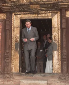 Prince Charles walking through a low temple door during his visit to Kathmandu in Nepal Prince Charles walking through a low temple door during his visit to Kathmandu in Nepal