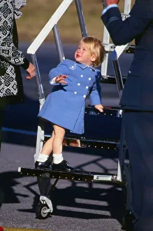Prince Harry July 1987 wearing a blue coat standing on the steps of a plane Prince Harry July 1987 wearing a blue coat standing on the steps of a plane