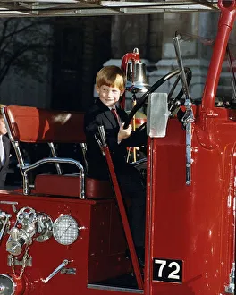 Prince Harry sitting at the wheel of a 1937 fire engine October 1990 Prince Harry sitting at the wheel of a 1937 fire engine October 1990