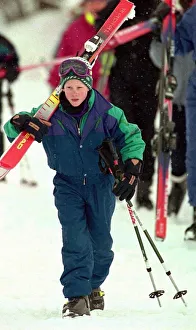 PRINCE HARRY STANDING IN THE SNOW HOLDING HIS SKIS DURING HIS HOLIDAY IN LECH PRINCE HARRY STANDING IN THE SNOW HOLDING HIS SKIS DURING HIS HOLIDAY IN LECH