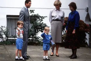 Prince Harry, wearing a blue sweatshirt shorts and Thomas the Tank Engine bag Prince Harry, wearing a blue sweatshirt shorts and Thomas the Tank Engine bag
