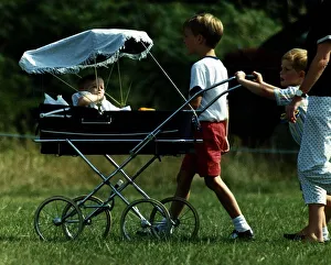 Prince William Collection 1989 Princess Beatrice is being pushed in pram by Prince William Collection 1989 Princess Beatrice is being pushed in pram by