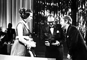 Images Dated 5th March 1971: Princess Anne presents the award for best Television light entertainment show to Eric