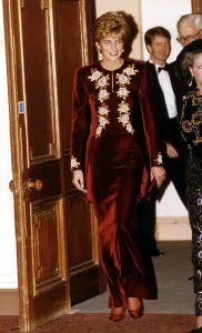 Princess Diana arrives for the Nutcracker ballet. She is wearing a burgundy velvet Princess Diana arrives for the Nutcracker ballet. She is wearing a burgundy velvet
