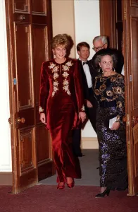 Princess Diana arrives for the Nutcracker ballet. She is wearing a burgundy velvet Princess Diana arrives for the Nutcracker ballet. She is wearing a burgundy velvet