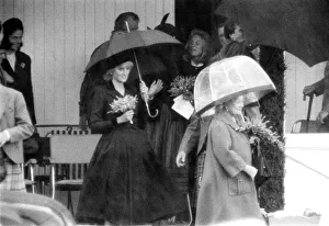 Princess Diana and The Queen Mother hide underneath their umbreallas during a heavy Princess Diana and The Queen Mother hide underneath their umbreallas during a heavy