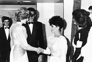 Princess Diana shakes hands with actress Joan Collins at a Bruce Oldfield London fashion Princess Diana shakes hands with actress Joan Collins at a Bruce Oldfield London fashion