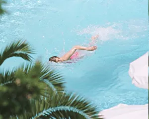 Princess Diana swimming in the pool while on holiday at Richard Branson' Princess Diana swimming in the pool while on holiday at Richard Branson'