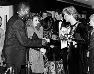 Princess Diana wearing a Catherine Walker dress, meets British boxer Frank Bruno at Princess Diana wearing a Catherine Walker dress, meets British boxer Frank Bruno at