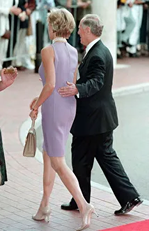 Princess Diana, wearing a purple dress is escorted to lunch by Australian dignitary Tom Princess Diana, wearing a purple dress is escorted to lunch by Australian dignitary Tom