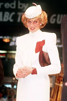 Princess Diana, wearing a white ensemble with red accents Princess Diana, wearing a white ensemble with red accents