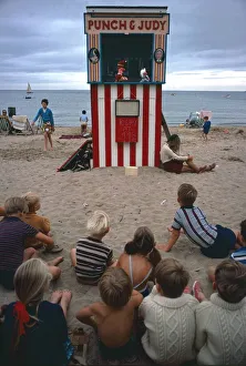 Punch and Judy show on Swanage beach, Dorset. 1970s August 1972 Punch and Judy show on Swanage beach, Dorset. 1970s August 1972