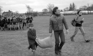 Pupil, Aiden Reeve and TV presenter, Chris Wenner is seen here carrying the sack full of Pupil, Aiden Reeve and TV presenter, Chris Wenner is seen here carrying the sack full of