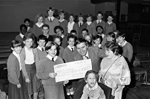 Pupils from Salendine Nook High School, present a cheque for 850 poounds to John Proctor Pupils from Salendine Nook High School, present a cheque for 850 poounds to John Proctor