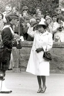 Queen Elizabeth II looking scared and gormless Holding hat on head Chatting Queen Elizabeth II looking scared and gormless Holding hat on head Chatting