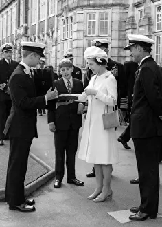 Queen Elizabeth II and Prince Andrew admire a commemorative Worcester plate presented to Queen Elizabeth II and Prince Andrew admire a commemorative Worcester plate presented to