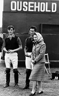 Queen Elizabeth II and Prince Charles June 1979 laugh at the score board at a polo Queen Elizabeth II and Prince Charles June 1979 laugh at the score board at a polo