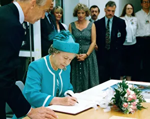 Queen Elizabeth II signs the visitors book at the British Council Offices, Manchester Queen Elizabeth II signs the visitors book at the British Council Offices, Manchester