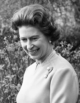 Queen Elizabeth II smiles in the grounds of Windsor Castle during a photocalll to mark Queen Elizabeth II smiles in the grounds of Windsor Castle during a photocalll to mark