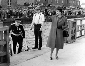 Queen Elizabeth II visits Wigan Pier. The Queen waves to the crowd on the Quayside Queen Elizabeth II visits Wigan Pier. The Queen waves to the crowd on the Quayside