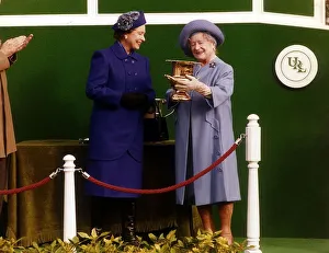 Queen Elizabeth and the Queen Mother March 1990 at Sandown Horseracing holding Queen Elizabeth and the Queen Mother March 1990 at Sandown Horseracing holding