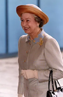Queen Elizabeth wearing light brown suit and hat, arrives at the Guildhall in London Queen Elizabeth wearing light brown suit and hat, arrives at the Guildhall in London