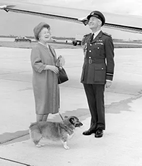 Queen Mother with RAF officer and corgi at Heathrow Airport in May 1983 Queen Mother with RAF officer and corgi at Heathrow Airport in May 1983