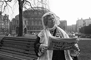 A Queen Victoria lookalike sitting on a park bench in Kensington Gardens close Royal A Queen Victoria lookalike sitting on a park bench in Kensington Gardens close Royal