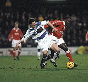 Queens Park Rangers defender tackles Charlton forward during the Queens Park Rangers v Queens Park Rangers defender tackles Charlton forward during the Queens Park Rangers v