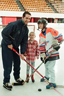 Rachel Toth watches as her mam Mary and Sheffield Steelers Ice Hockey player Andre Malo Rachel Toth watches as her mam Mary and Sheffield Steelers Ice Hockey player Andre Malo