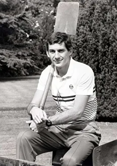 Racing driver Ayrton Senna, doing a spot of gardening, with shovel over his shoulder at Racing driver Ayrton Senna, doing a spot of gardening, with shovel over his shoulder at