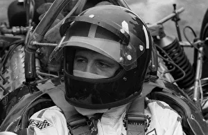 Racing driver Graham Hill at Brands hatch circuit 1970 sitting in Lotus car in Racing driver Graham Hill at Brands hatch circuit 1970 sitting in Lotus car in