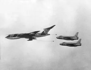 Two RAF English Electric Lightning jet fighter aircraft prepare to refuel from a Handley Two RAF English Electric Lightning jet fighter aircraft prepare to refuel from a Handley