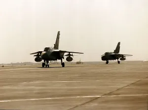 Two RAF Panavia Tornado F3 fighter planes used in the Gulf War taxi along runway Two RAF Panavia Tornado F3 fighter planes used in the Gulf War taxi along runway