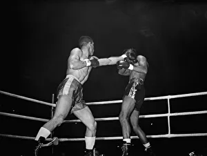 Randolph Turpin lands a punch during his title fight against Sugar Ray Robinson fight at Randolph Turpin lands a punch during his title fight against Sugar Ray Robinson fight at