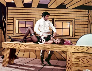 Raquel Welch and Tom Jones acting during a TV show television lying on a Raquel Welch and Tom Jones acting during a TV show television lying on a