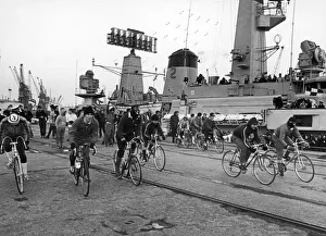 Ratings from HMS Jupiter seen here taking part in a cycle race started from the bridge of Ratings from HMS Jupiter seen here taking part in a cycle race started from the bridge of