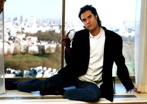Ray Davies The Kinks pop group singer sitting on office window ledge March 1990 Ray Davies The Kinks pop group singer sitting on office window ledge March 1990