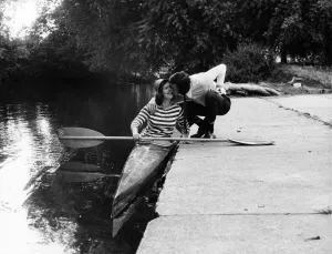 Ray Haynes kisses his wife Janice goodbye as she sets off to paddle to work from Windsor Ray Haynes kisses his wife Janice goodbye as she sets off to paddle to work from Windsor