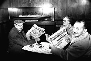 Images Dated 18th October 1980: Three regulars at the Mauretania Pub in Wallsend, reading a copy of the Newcastle Journal