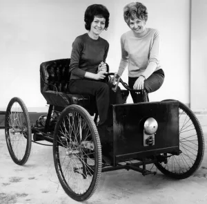 Replica Henry Ford Quadricycle being tried out by office girls Joan Milner Replica Henry Ford Quadricycle being tried out by office girls Joan Milner