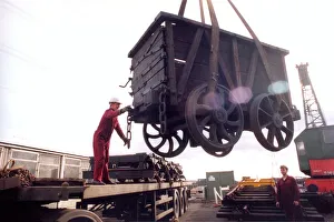 Restoration engineer Grodon Stark, on the flat bed is helping to move an anciet wagon at Restoration engineer Grodon Stark, on the flat bed is helping to move an anciet wagon at